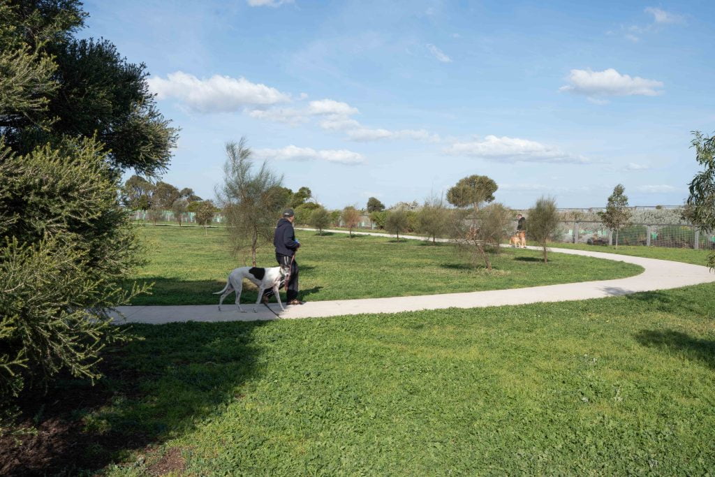 Concrete walking path at P A Burns Reserve Fenced Dog Park in Altona